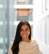 Profile image of woman wearing a white sweater