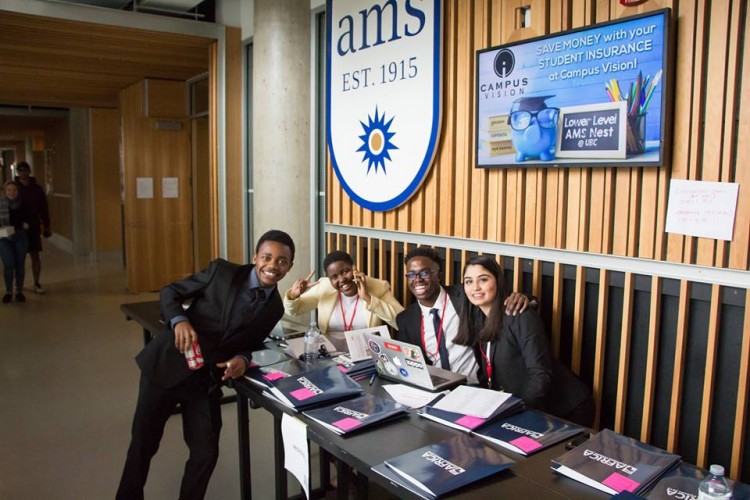 Sharon sitting at a table with colleagues