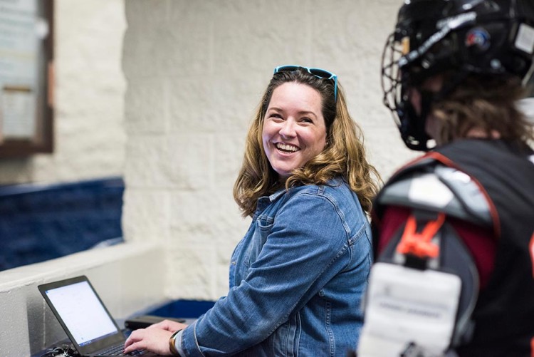 Image of Kerry talking to a hockey player