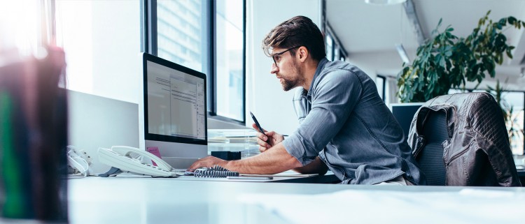 Male using a desktop computer